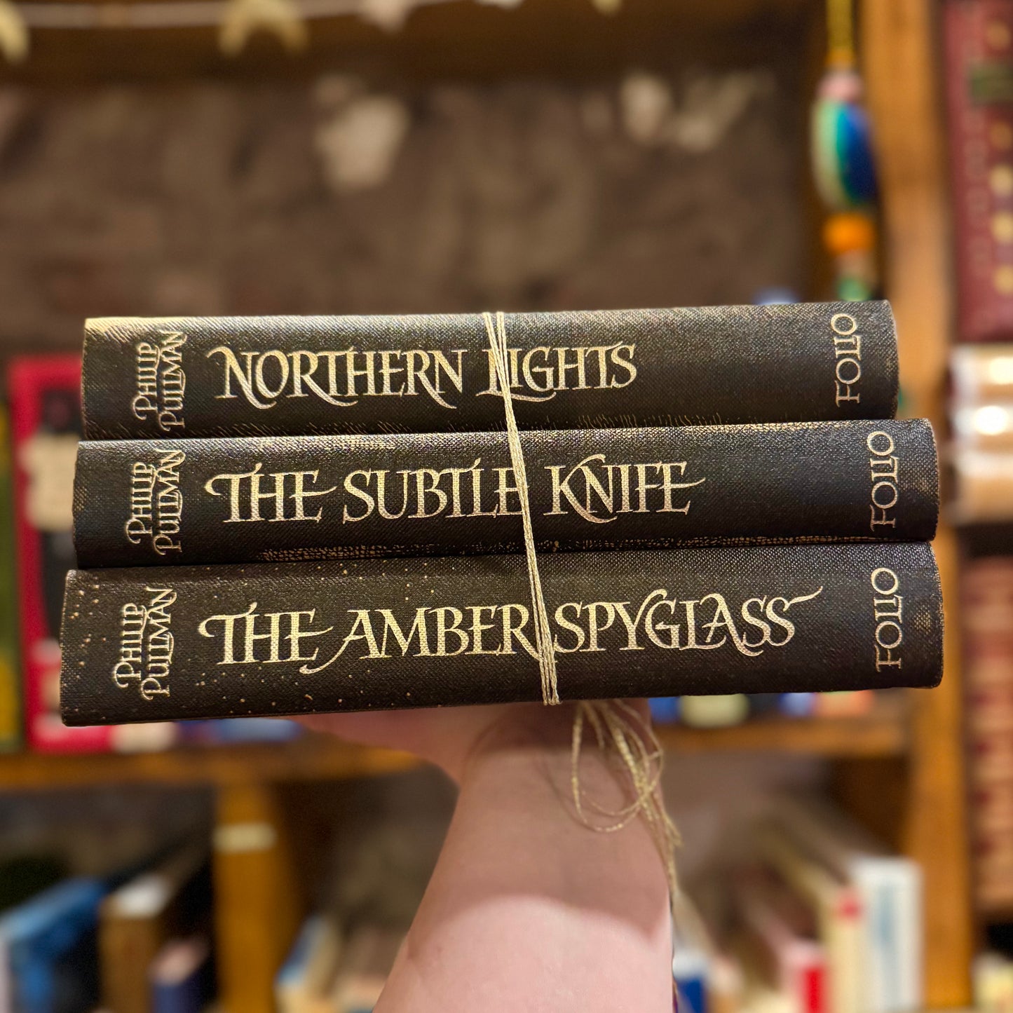 His Dark Materials Trilogy (First Edition Folio) – Philip Pullman and Peter Bailey
